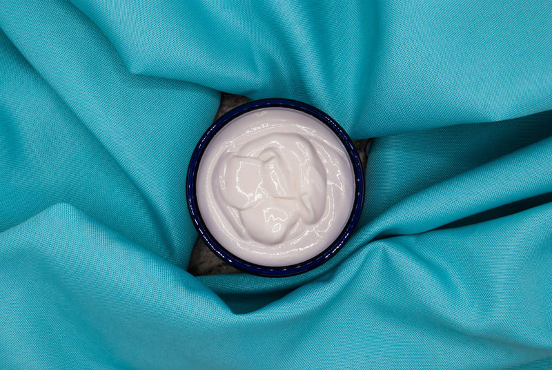 Top view of dulce vida body butter texture in 8oz plastic jar