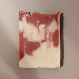 Top view of Rose cream colored soap with pink clay swirls